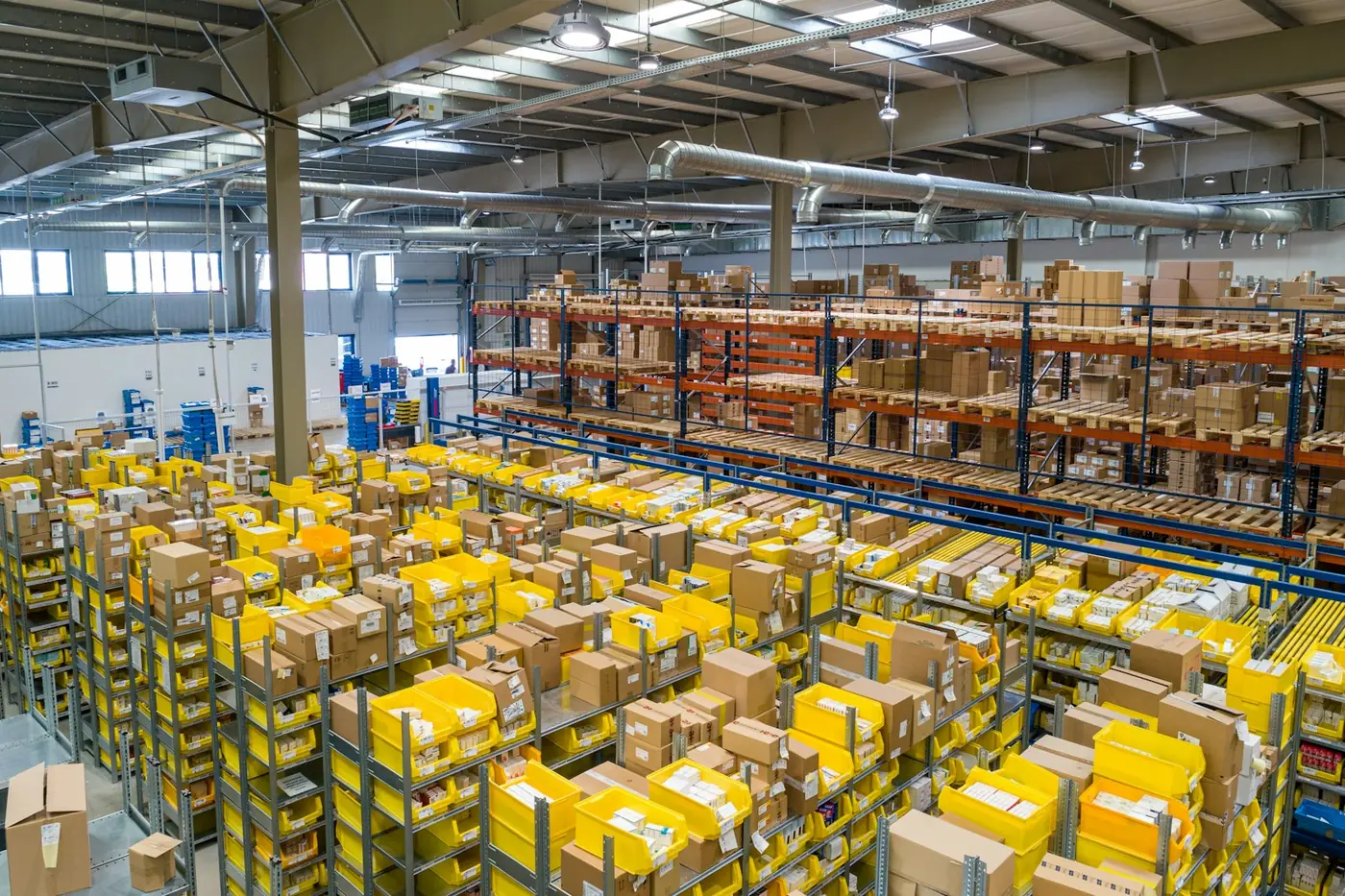 Organized warehouse aisle with poultry product inventory on industrial shelving